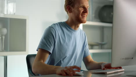 excited worker talking online finishing conference call at remote home office.
