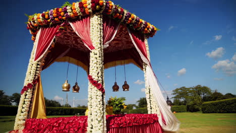 beautifully decorated wedding mandap with floral garlands