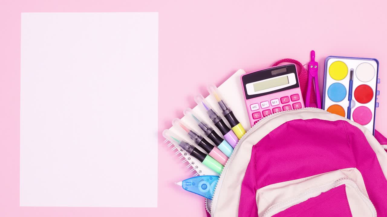 School tools appear from pink backpack and wrapped paper unwrap for text. Stop motion
