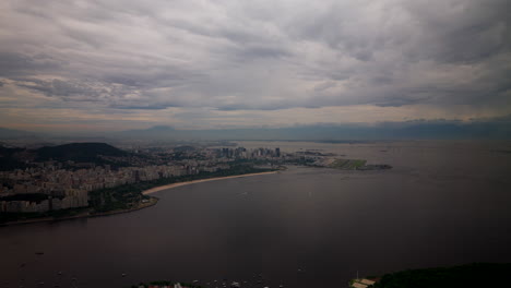 cloudy sky over coastal city of rio de janeiro near sugarloaf mountain in brazil. wide aerial shot