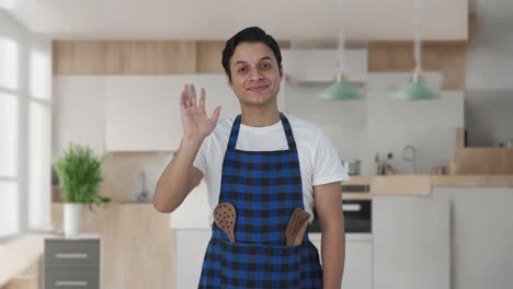 cocinero indio feliz diciendo hola
