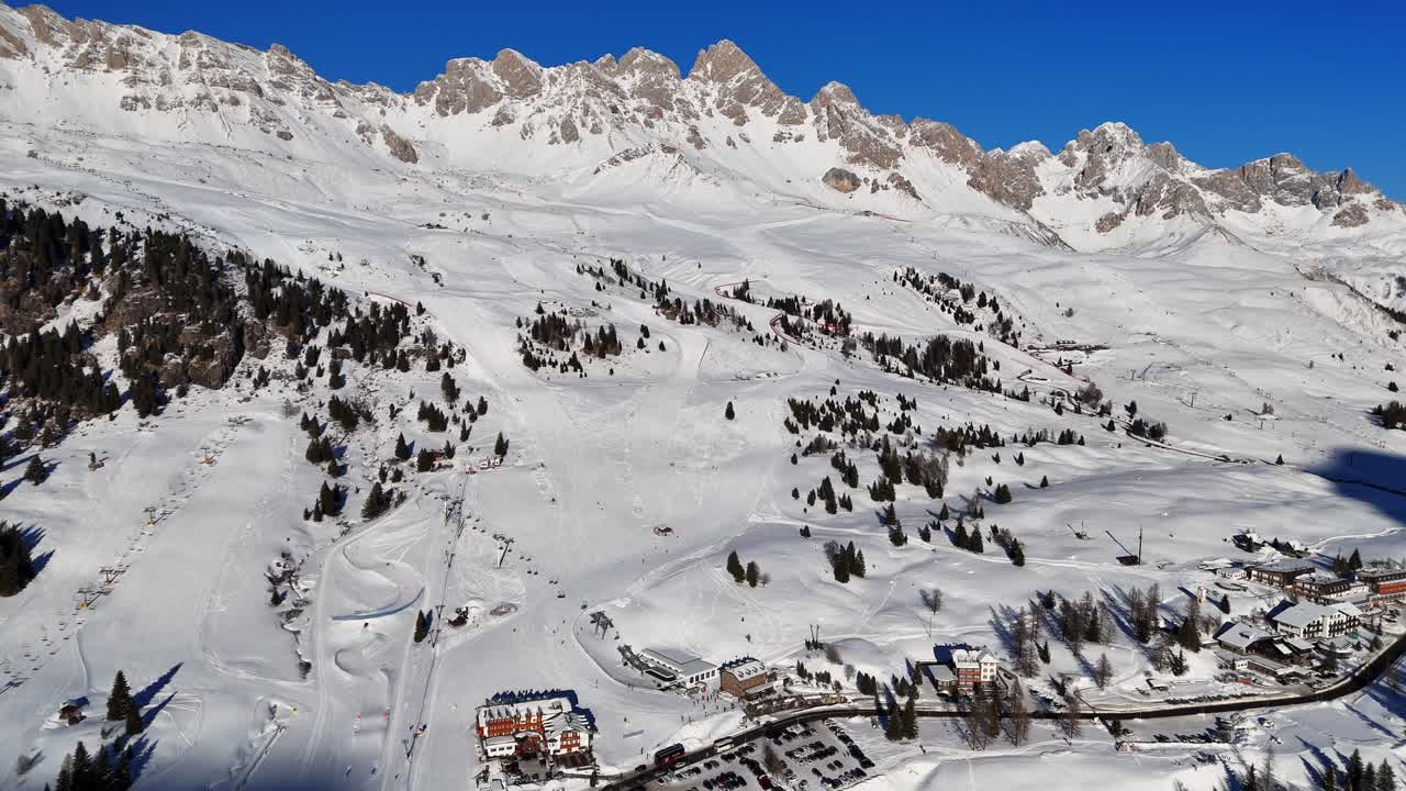 Ski resort in the Italian Dolomites mid winter (drone footage)