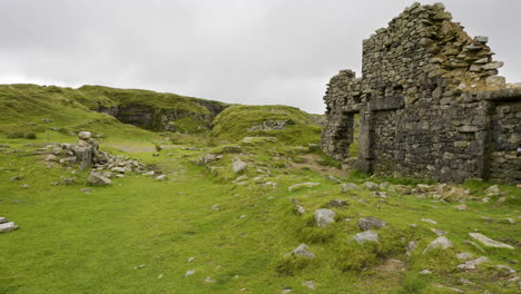 ruined stone structure in a green valley
