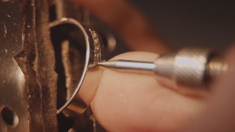 jeweler repairing a diamond ring