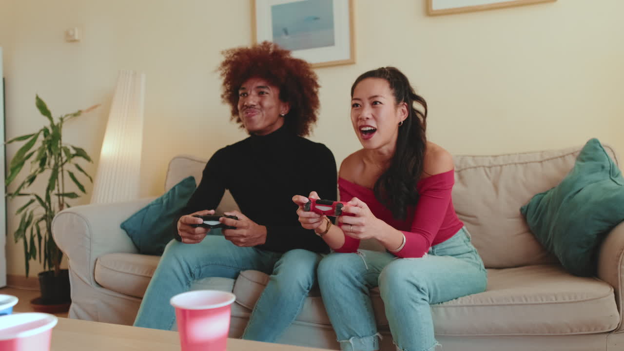 Couple Playing Video Games at Home