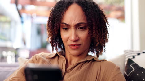 concerned woman looking at smartphone
