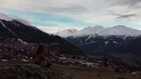 Circling-over-a-red-hair-woman-enjoying-the-beautiful-sunset-over-the-Val-de-Bagnes