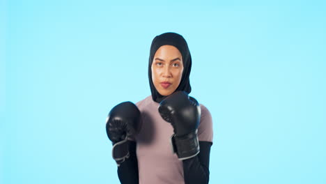 Portrait,-woman-and-muslim-boxer-in-blue-studio