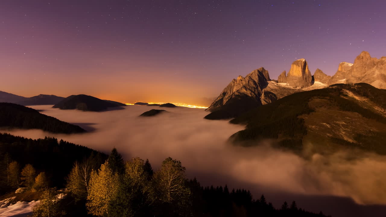 Time Lapse of Foggy Mountain Valley at Night with Stars