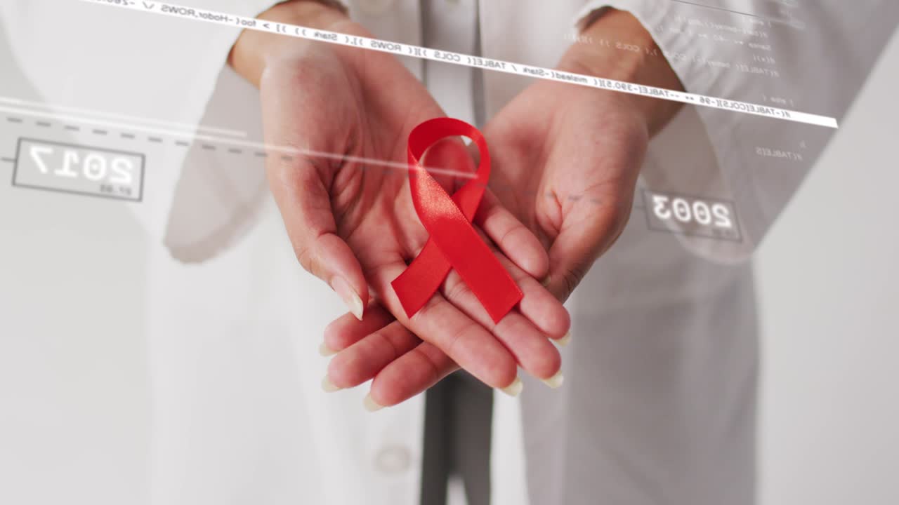 Professionnel de la santé tenant un ruban rouge en avant, avec des chiffres HUD (affichage tête haute) défilant et des superpositions s'estompant, promouvant la santé.