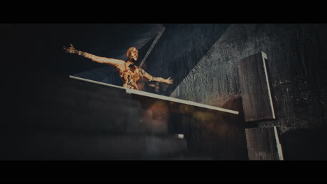 bronze figure in a futuristic concrete structure