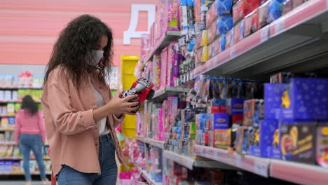 woman shopping for toys in a toy store