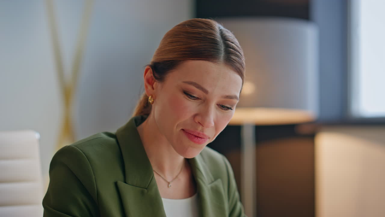 Excited lady speaking laptop call at open space office closeup. Woman talking