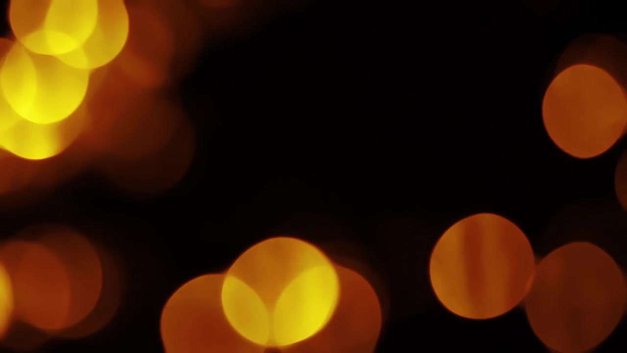 Soft Orange and Yellow Bokeh Lights Fading In and Out