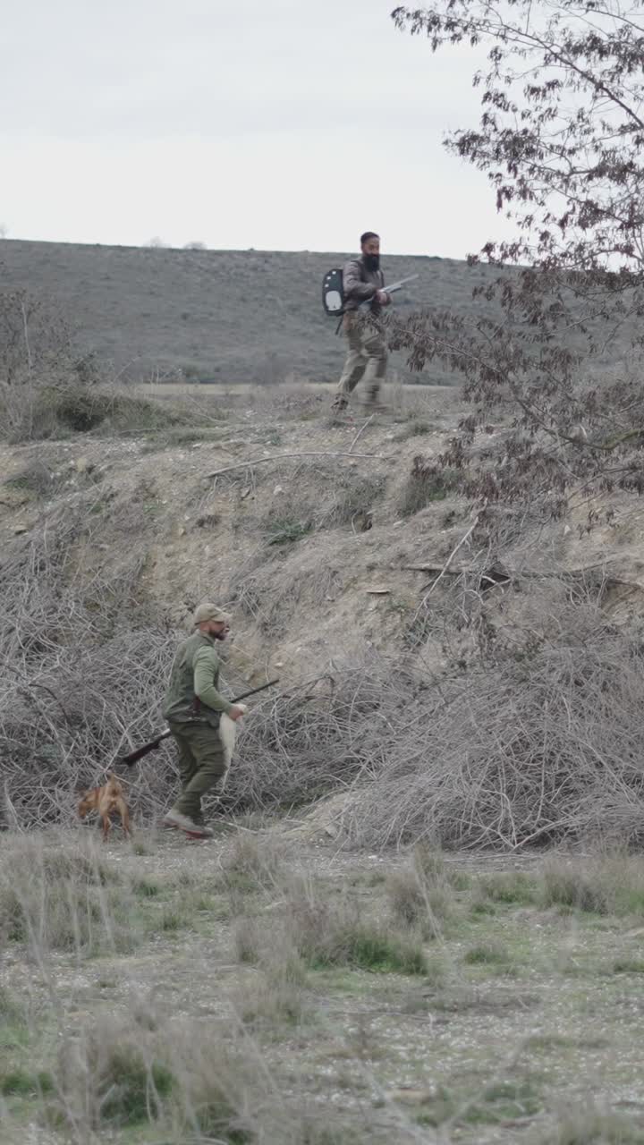 Hunters in the countryside with a dog