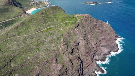 Perilous beauty unfolds on Hawaii&#039;s coast, marked by towering white waves and iconic volcanic rock formations