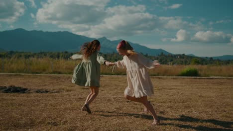 two women running through a field