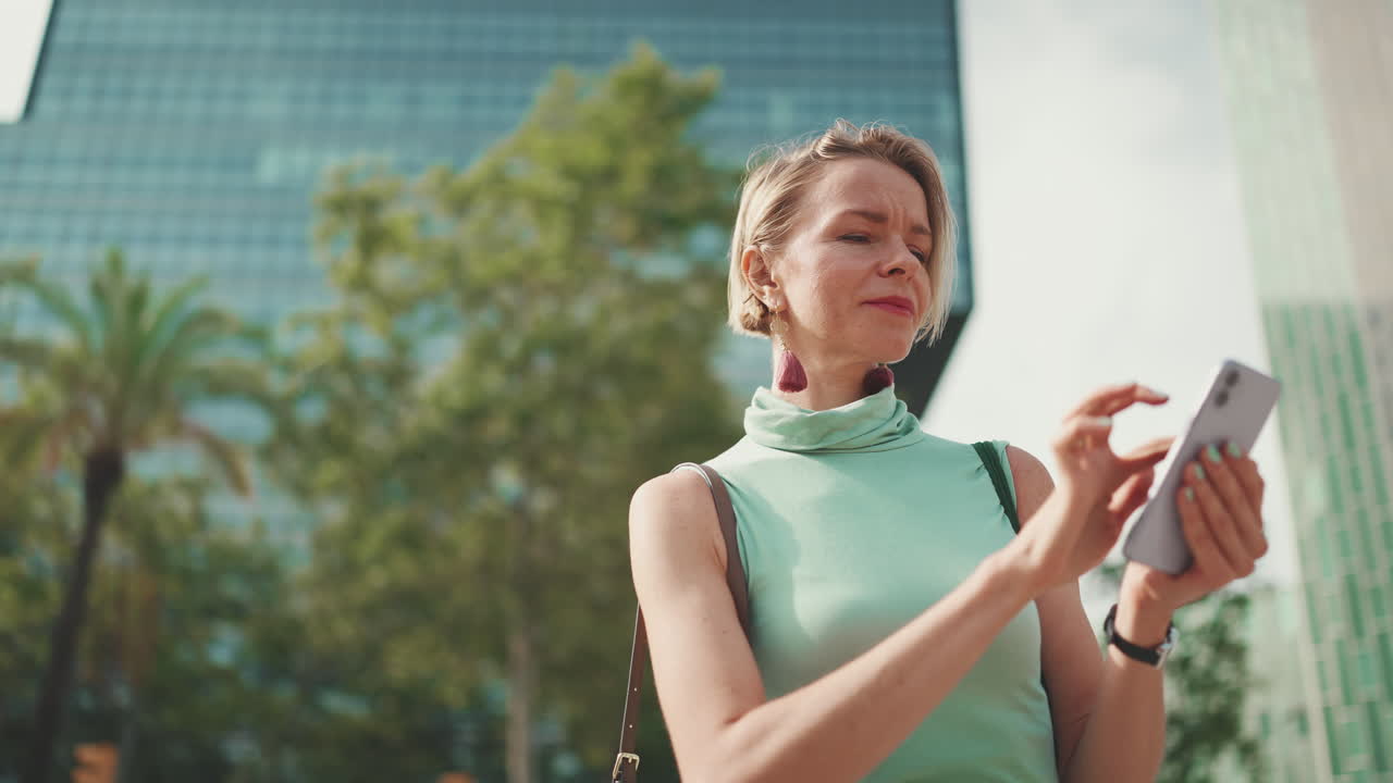 Woman using smartphone in urban environment