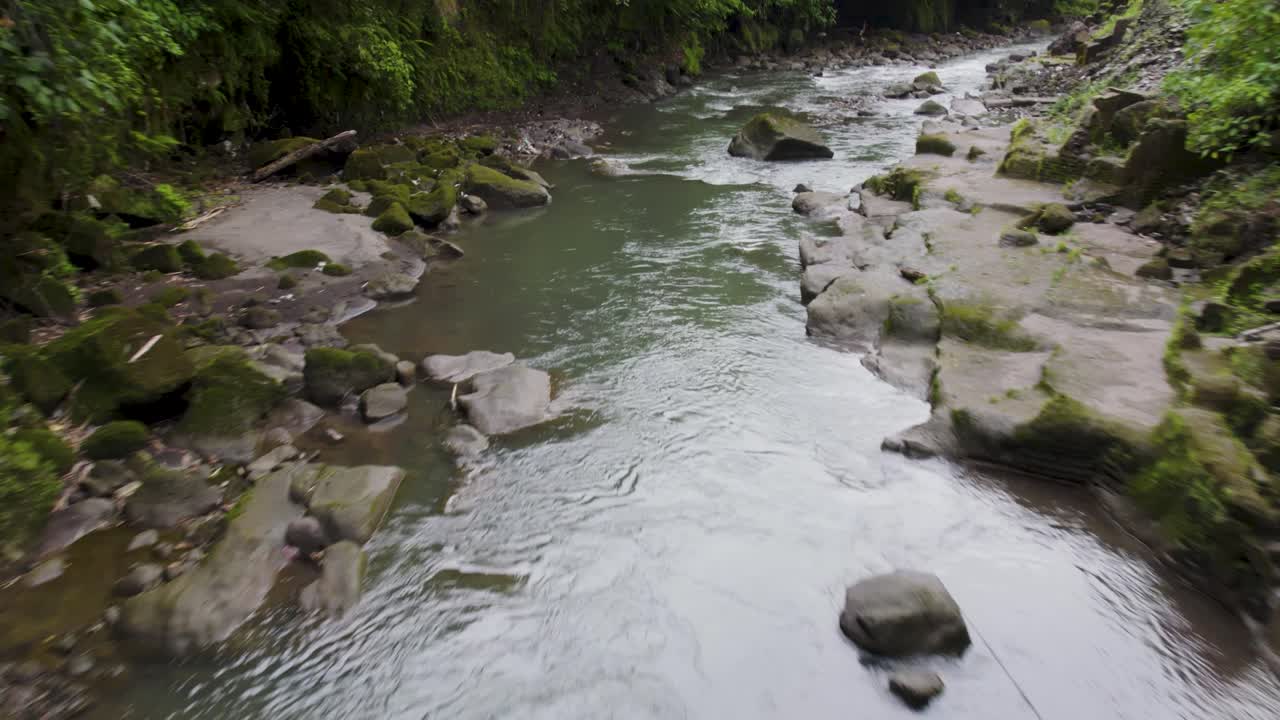 People exploring a tropical river gorge