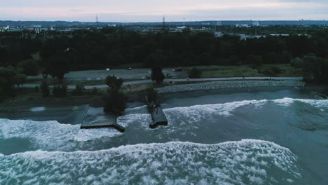 with the sun just dipping below the horizon, blue light descends across this body of water