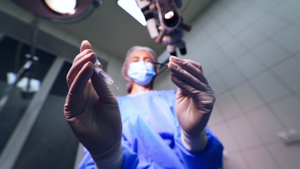 Surgeon close up portrait. Close up shot of male surgeon performing operation