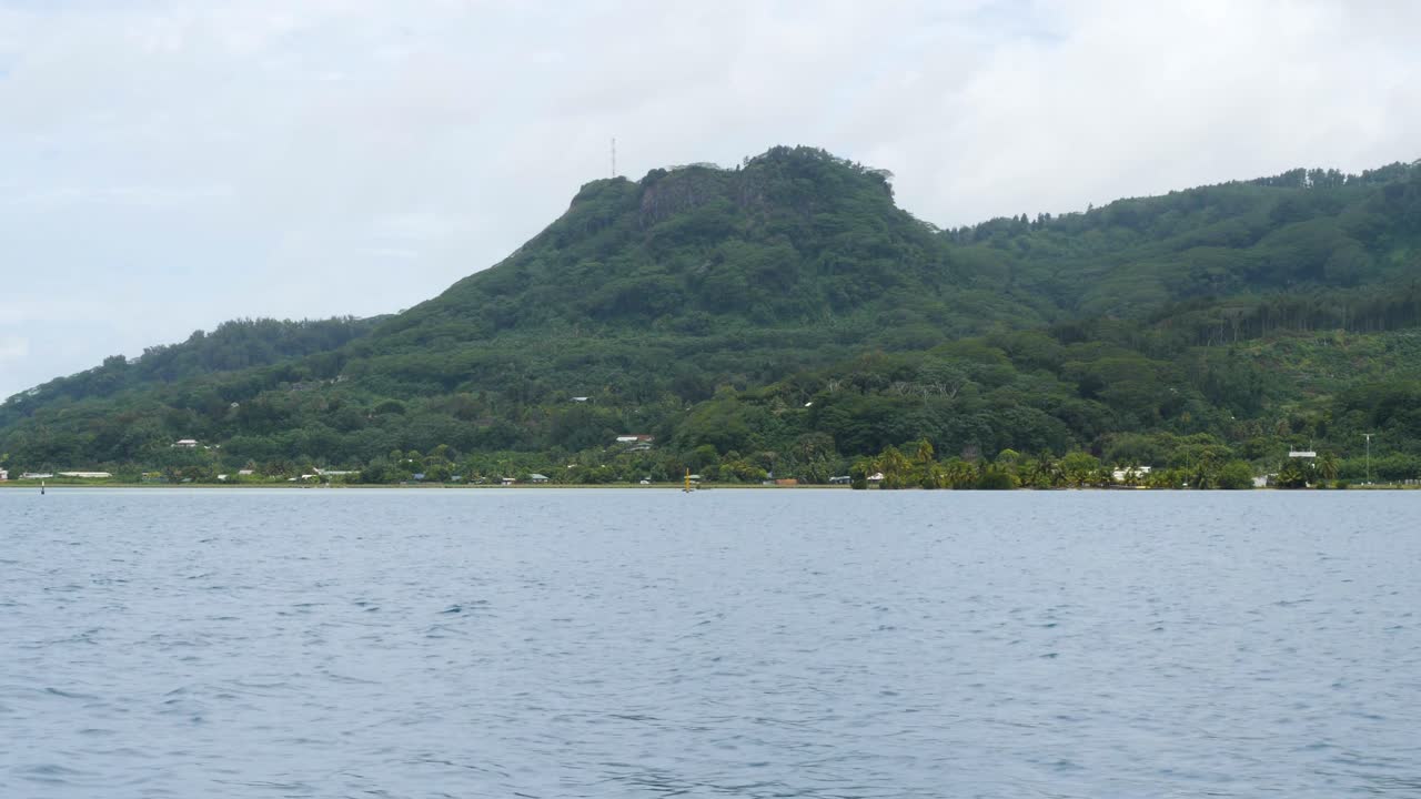 Serene Island Landscape with Lush Green Mountain and Calm Ocean