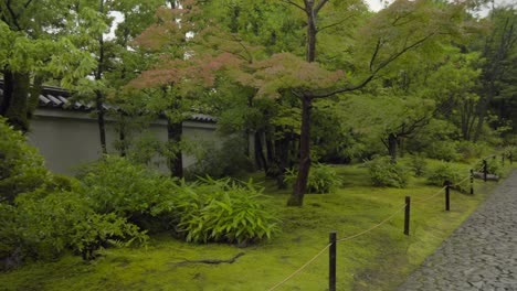 kokoen japanese traditional garden entrance to kassui ken restaurant and lords residence stone path panning shot