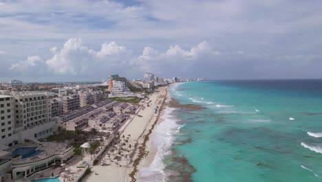 cancun coastline with seaside hotel resorts in mexico - aerial