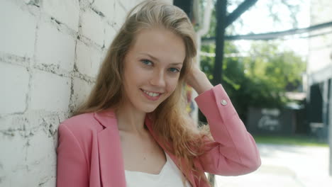young woman in pink blazer