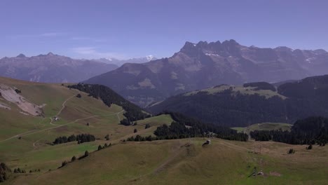 aerial landscape flight over the forest in mountain, bec du corbeau, switzerland