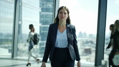 businesswoman walking in a modern office building