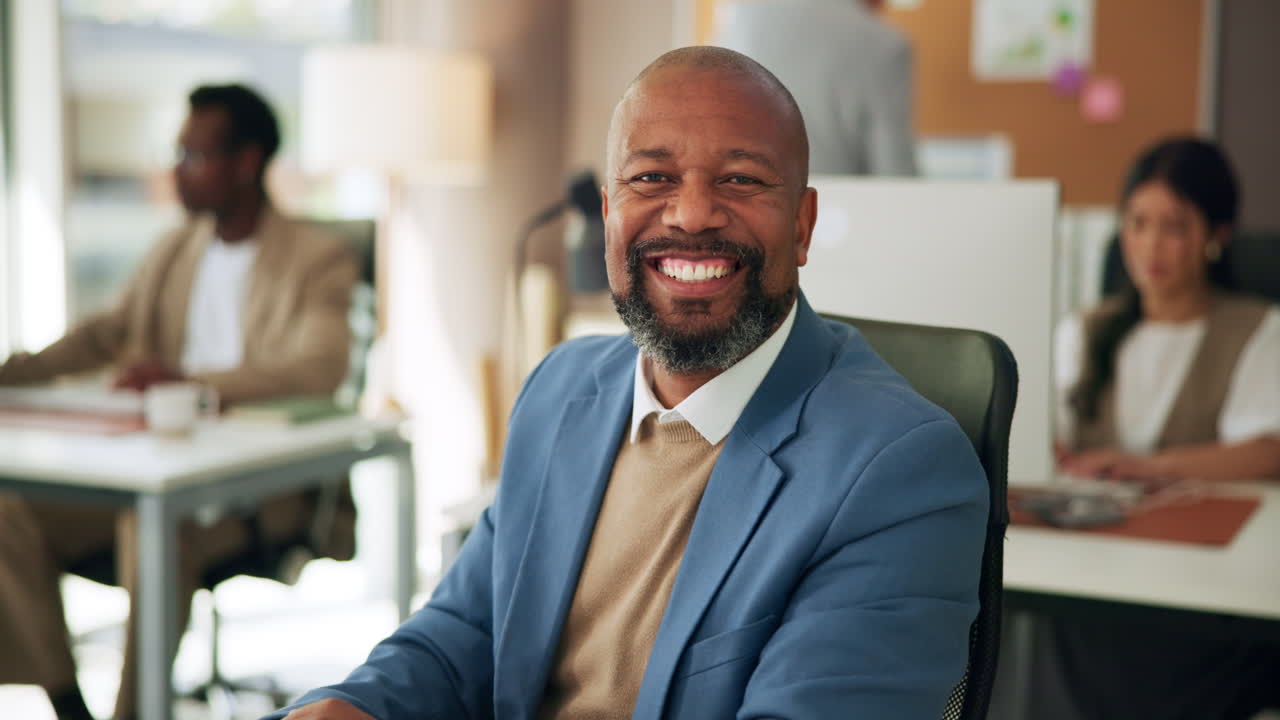 Happy African American Businessman Smiling in a Modern Office