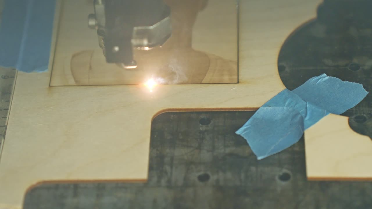 A Laser Engraver Etching The Frame Around A Portrait That Has Been ...