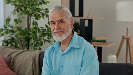 older man sitting on a sofa