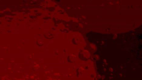 slow motion posterized red lava lamp macro shot background with lots of bubbles