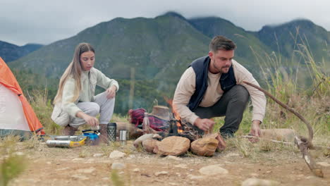 campfire wood, couple and tent in nature