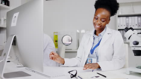 Scientist,-computer-and-black-woman-writing