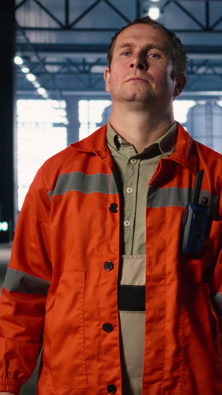 Vertical Video Industrial supervisor walking around factory floor and overseeing assembly teams