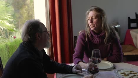 Elderly-couple-having-dinner-in-restaurant