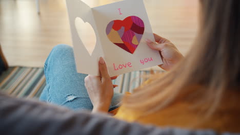 woman holding a handmade love card