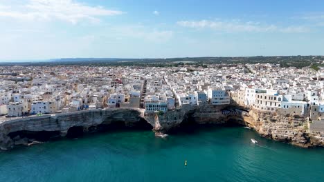 aerial footage of polignano a mare: a cliffside gem in puglia, italy