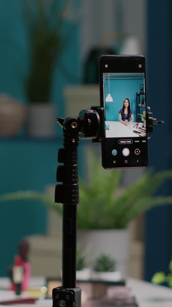 Vlogger recording a video on smartphone