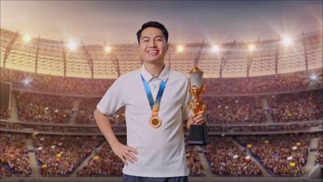 happy winner holding trophy in stadium