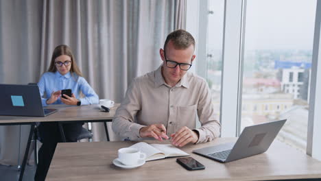 coworkers working in modern office setting