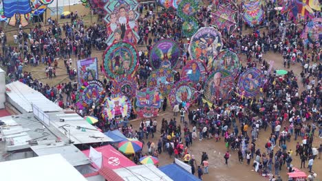 wide shot of populace gathered to celebrate in sumpango, guatemala, aerial