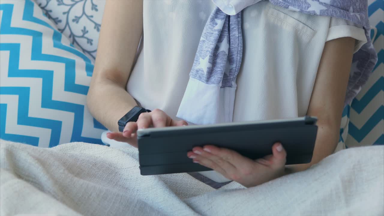 Woman Relaxing with Tablet
