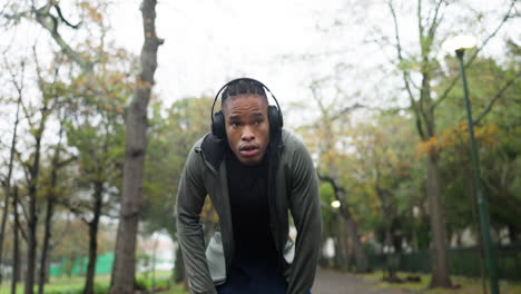 tired, running and sweat with black man in park