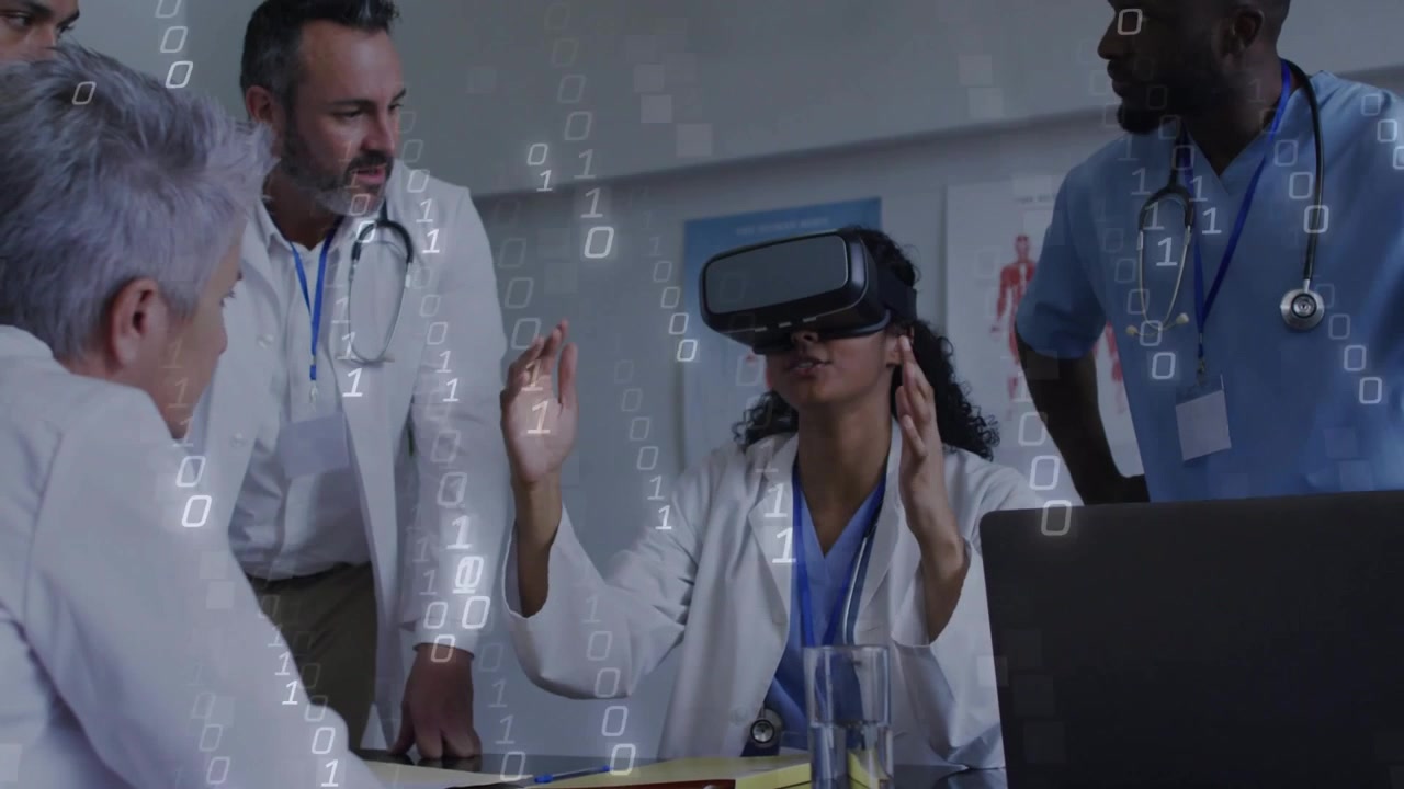 Woman medic in VR headset starting sim with pinching, sweeping, digits overlay guiding medical team