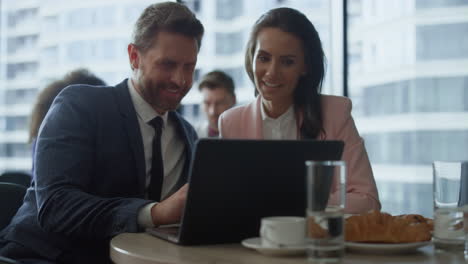 smiling business partners in a videocall