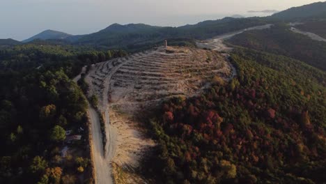 Aerial-over-fire-zone-in-the-forest-with-watch-tower